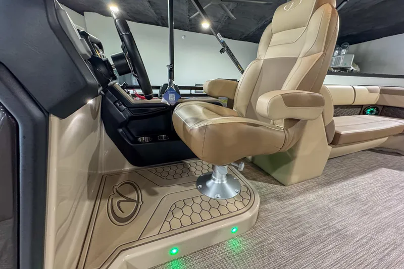 Slide: The Image of 2026 Veranda Relax VR265RC boat dashboard with steering wheel, digital display, and controls. - 12