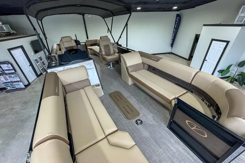 Slide: The Image of Interior of 2026 Veranda Relax VR265RC boat with beige seating and control panel. - 9