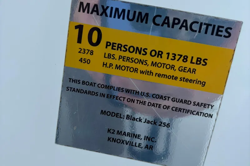 Slide: The Image of Maximum capacity label for BlackJack 256 Bay boat, 2022 model, 10 persons or 1378 lbs. - 12