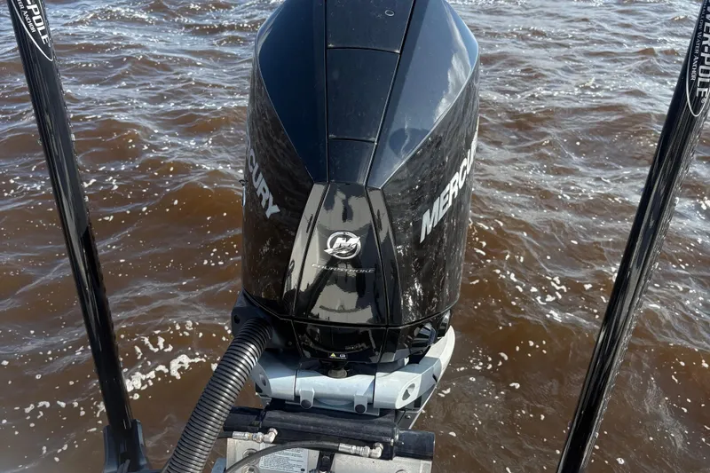 Slide: The Image of Mercury outboard motor on 2022 BlackJack 256 Bay boat in water. - 4