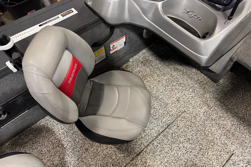 Slide: The Image of 2015 Tracker Targa V-18 Combo boat seat with gray and red upholstery. - 10