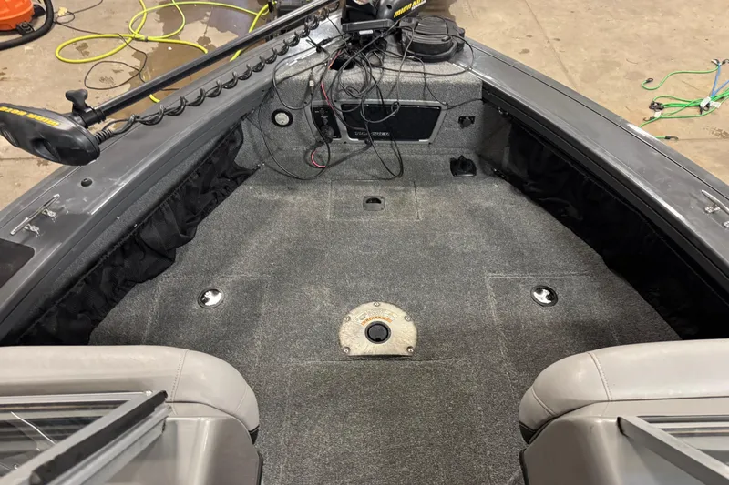 Slide: The Image of 2015 Tracker Targa V-18 Combo boat interior with carpeted deck and seating. - 12