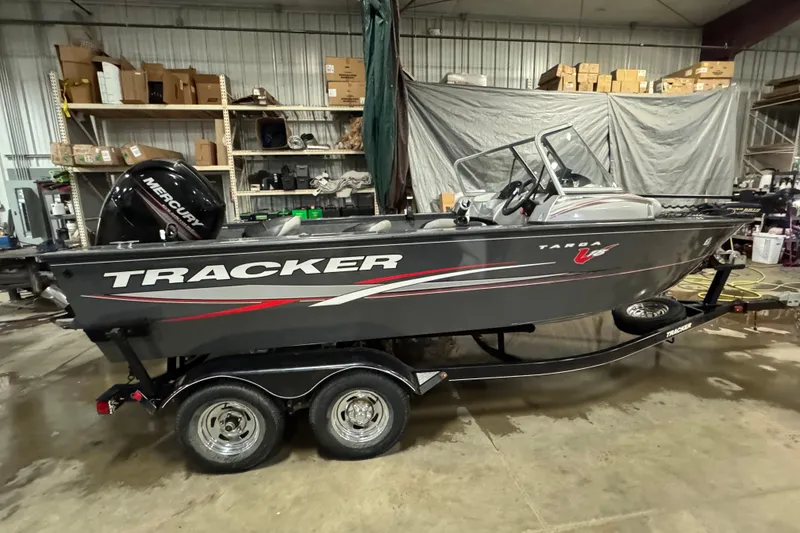 Slide: The Image of 2015 Tracker Targa V-18 Combo boat on trailer in a garage setting. - 4