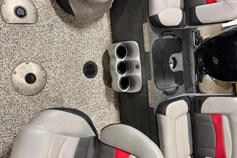 Slide: The Image of 2015 Tracker Targa V-18 Combo boat interior with seating and cup holders. - 7