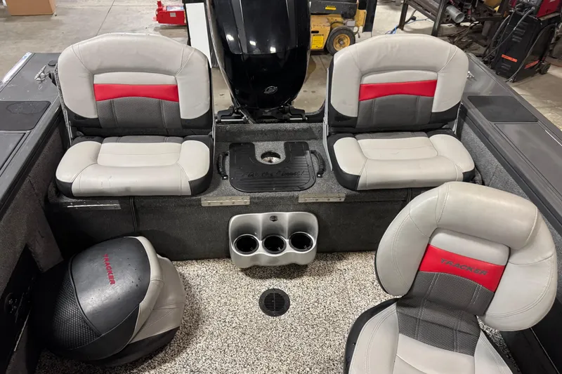 Slide: The Image of 2015 Tracker Targa V-18 Combo boat interior with gray and red seating. - 8