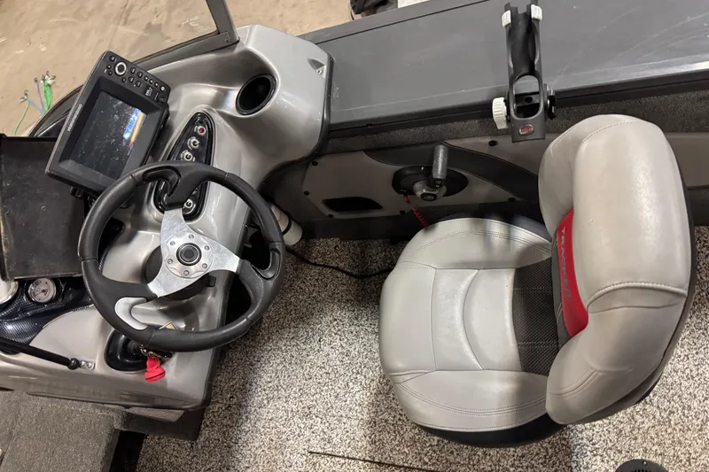 Slide: The Image of 2015 Tracker Targa V-18 Combo boat interior with steering wheel and seat. - 9