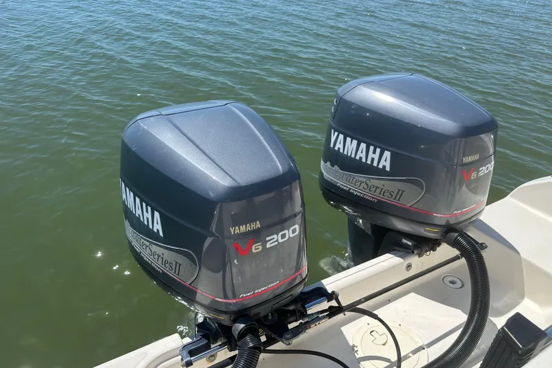Slide: The Image of Twin Yamaha V6 200 outboard motors on a 2000 Pursuit 2870 Walkaround boat. - 14