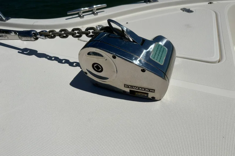 Slide: The Image of Chrome anchor windlass on 2000 Pursuit 2870 Walkaround boat deck. - 15
