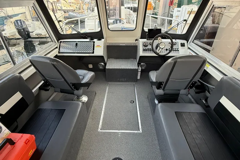 Slide: The Image of Interior of 2023 Thunder Jet 22 Alexis Pro boat with modern seating and control panel. - 14