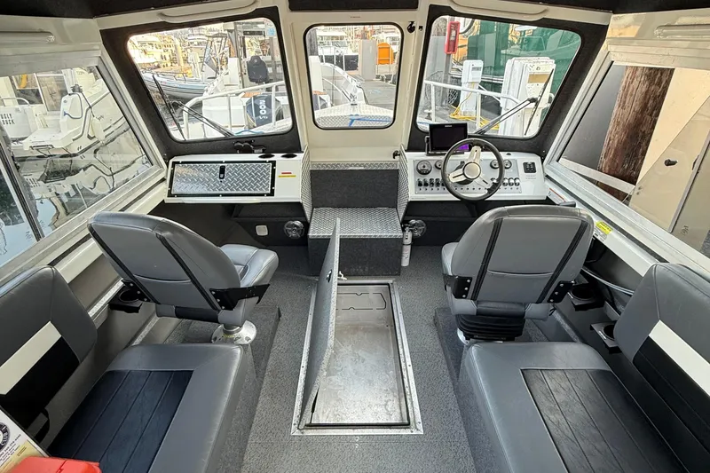 Slide: The Image of 2023 Thunder Jet 22 Alexis Pro boat with Mercury outboard motor at marina. - 5