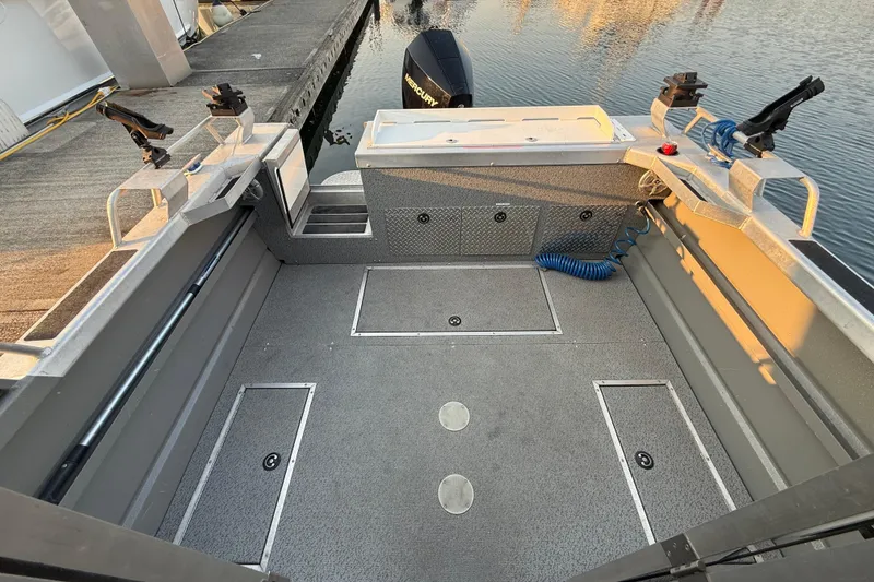 Slide: The Image of Interior of 2023 Thunder Jet 22 Alexis Pro boat with storage compartment and seating. - 9