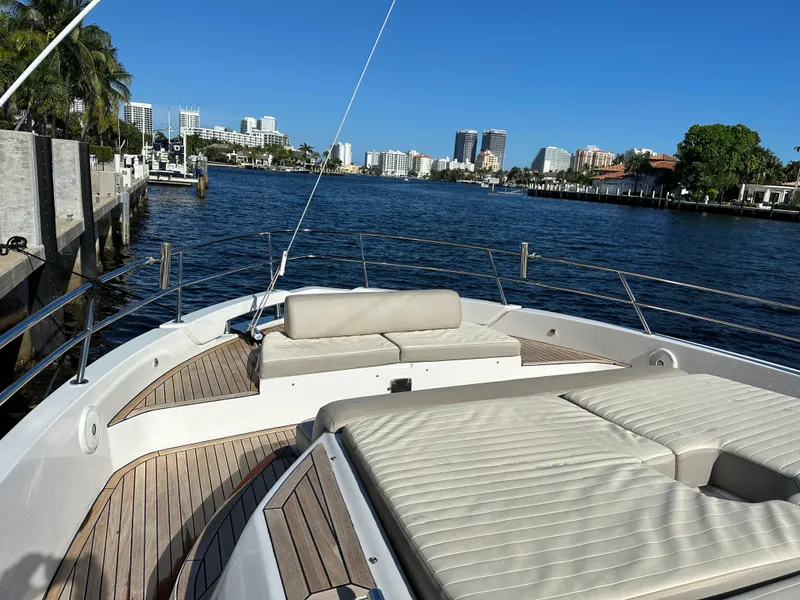 Slide: The Image of 2018 Azimut Verve 40 yacht on a sunny waterfront, showcasing luxury deck and seating. - 14