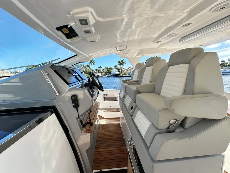 Slide: The Image of Interior of 2018 Azimut Verve 40 yacht with luxurious seating and helm, overlooking water. - 17