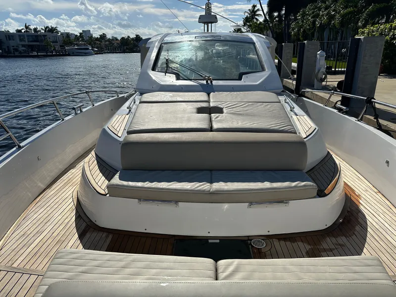 Slide: The Image of 2018 Azimut Verve 40 yacht with spacious deck and luxurious seating by the water. - 9