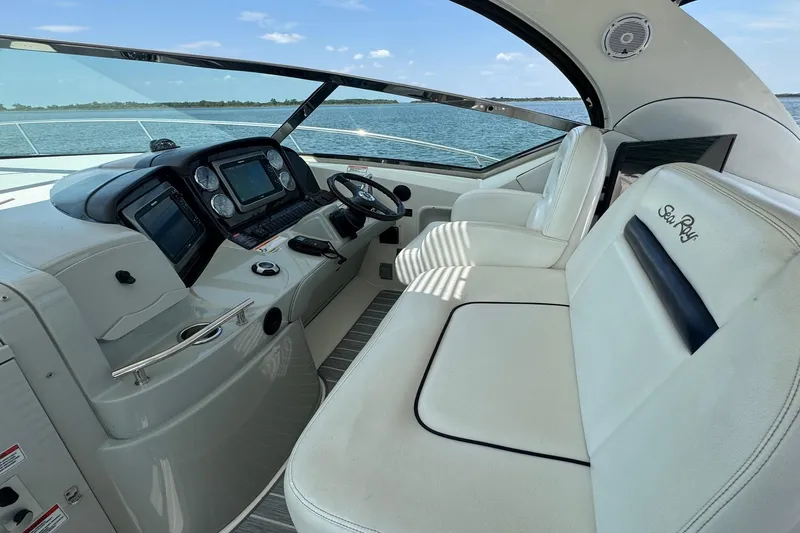 Slide: The Image of Interior of 2010 Sea Ray 390 Sundancer yacht with modern helm and seating. - 12