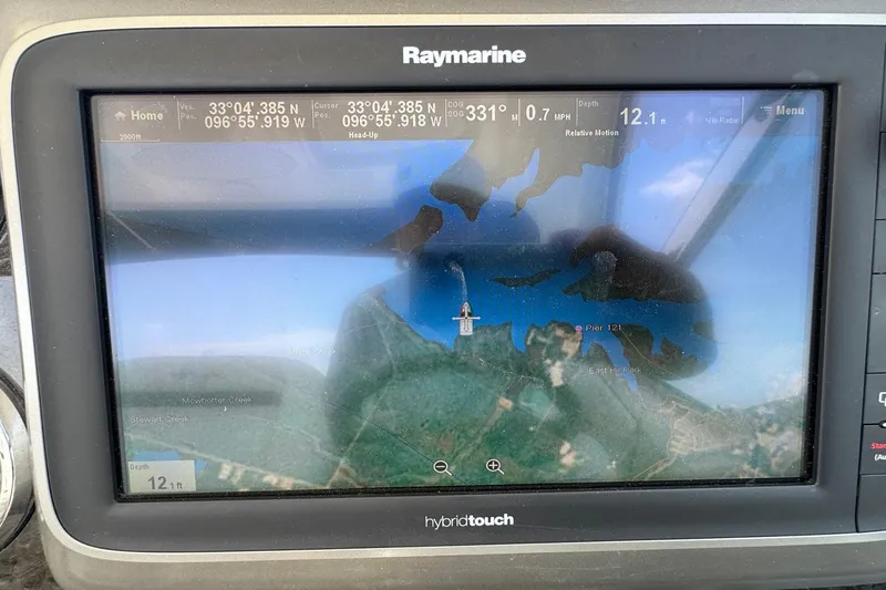 Slide: The Image of Raymarine GPS display on 2010 Sea Ray 390 Sundancer, showing navigation map and coordinates. - 17