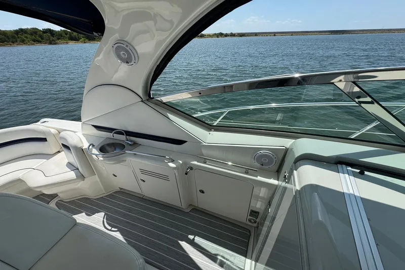 Slide: The Image of 2010 Sea Ray 390 Sundancer yacht interior with sleek design and water view. - 19