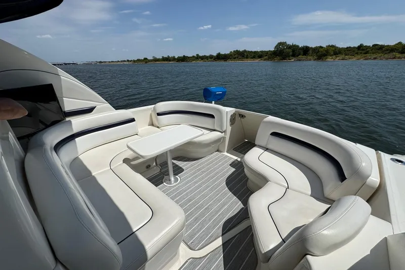 Slide: The Image of Luxurious seating area on 2010 Sea Ray 390 Sundancer yacht, overlooking serene waters. - 20