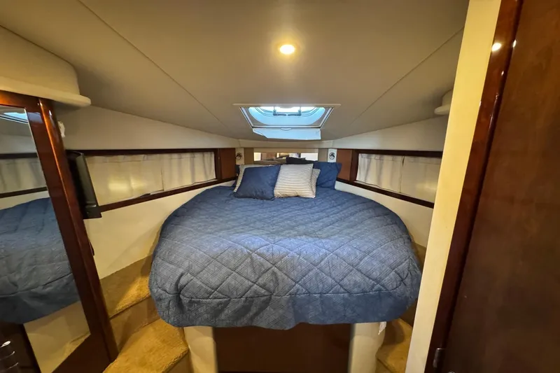 Slide: The Image of Luxurious cabin interior of 2010 Sea Ray 390 Sundancer yacht with cozy bedding. - 32