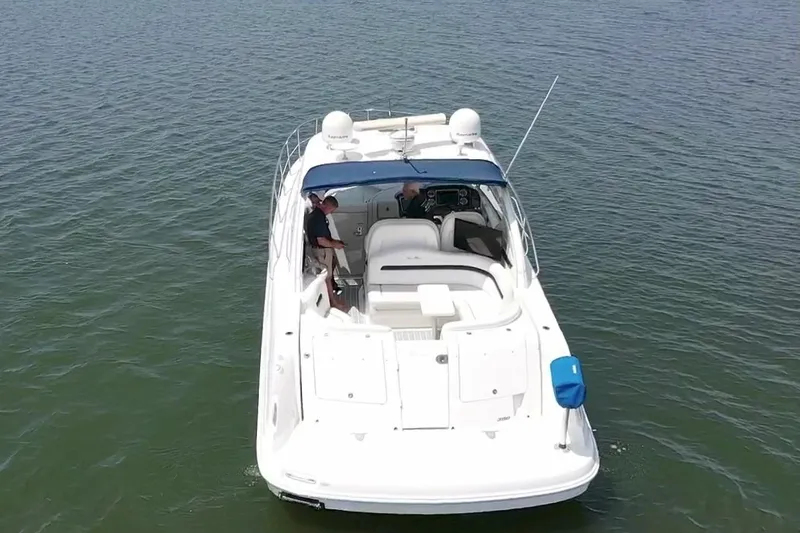 Slide: The Image of 2010 Sea Ray 390 Sundancer yacht cruising on open water, aerial view. - 5