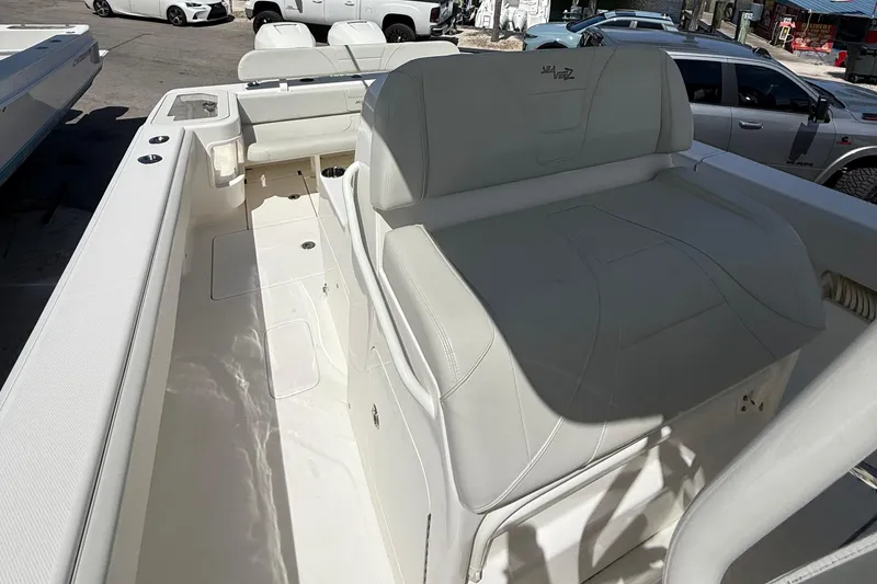 Slide: The Image of 2022 SeaVee 322z boat interior with white seating and spacious deck layout. - 6