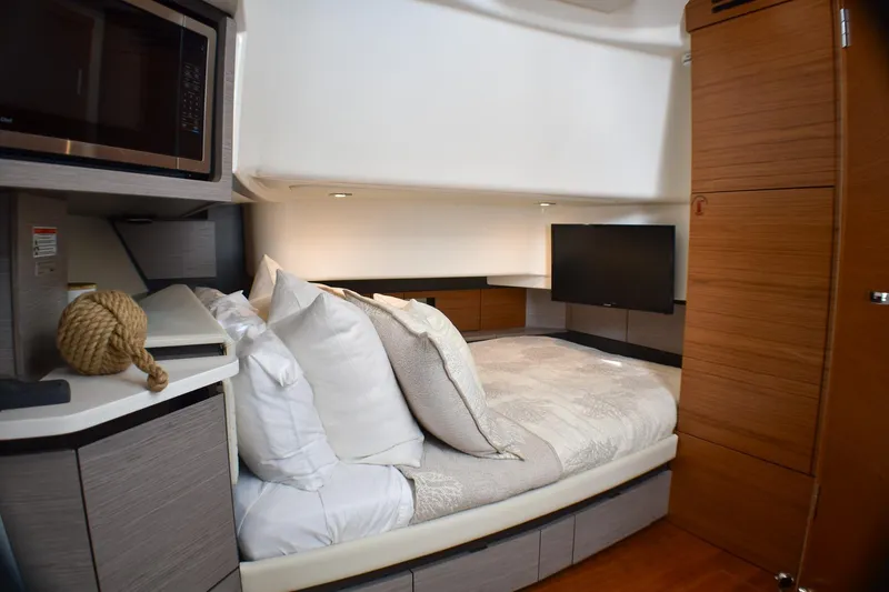 Slide: The Image of Luxurious cabin interior of 2025 Tiara Yachts 43 LS with cozy bed and modern amenities. - 14