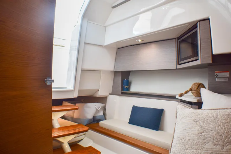 Slide: The Image of 2025 Tiara Yachts 43 LS interior with cozy seating and modern amenities. - 17