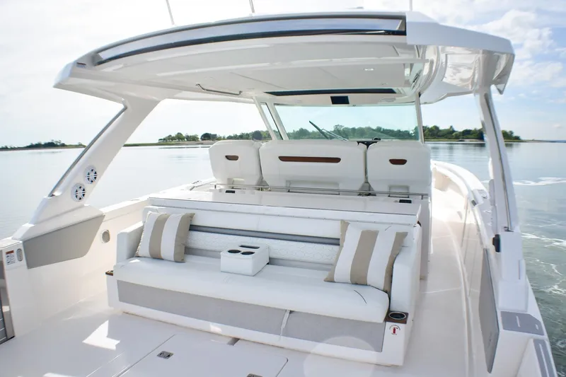 Slide: The Image of 2025 Tiara Yachts 43 LS luxury boat interior with plush seating and modern design. - 39