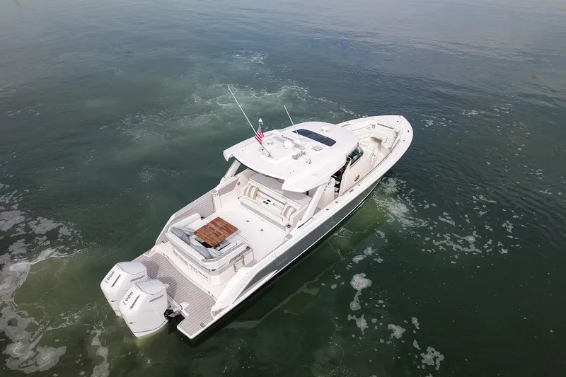 Slide: The Image of 2025 Tiara Yachts 43 LS cruising on calm waters, aerial view. - 8