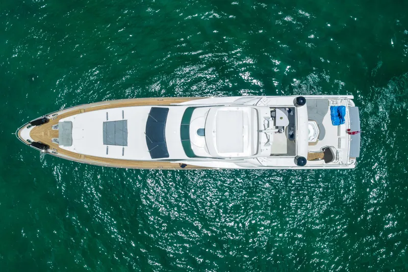 Slide: The Image of Aerial view of 2012 Azimut yacht on clear turquoise water. - 16