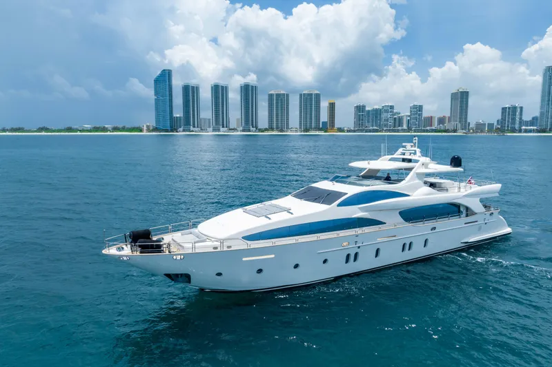 Slide: The Image of Luxurious 2012 Azimut yacht cruising near city skyline under blue sky. - 3