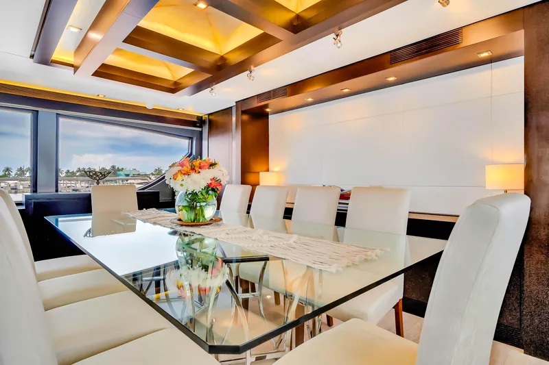 Slide: The Image of Luxurious dining area on 2012 Azimut yacht with elegant glass table and plush seating. - 35