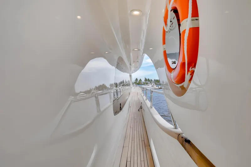 Slide: The Image of Side deck of 2012 Azimut yacht with lifebuoy and wooden flooring. - 46