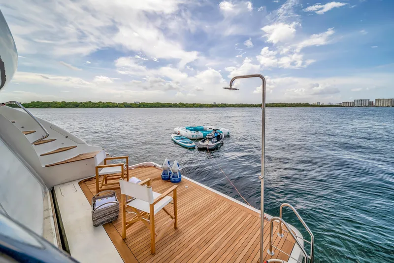 Slide: The Image of Luxury Azimut yacht deck with chairs, outdoor shower, and scenic ocean view, 2012 model. - 49