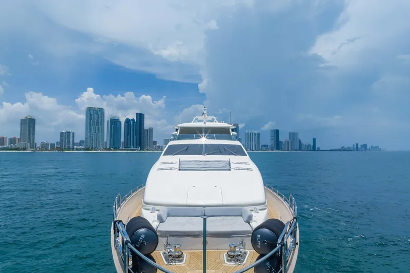 Slide: The Image of Luxurious 2012 Azimut yacht cruising near a city skyline under a partly cloudy sky. - 9