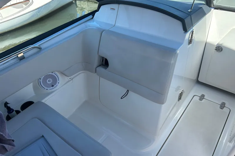 Slide: The Image of Interior of a 2017 Boston Whaler 230 Vantage boat, featuring seating and storage. - 7