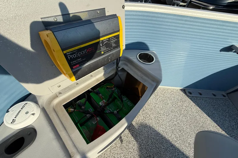 Slide: The Image of 2021 Bennington 20SFi boat battery compartment with ProSport HD12 charger. - 12