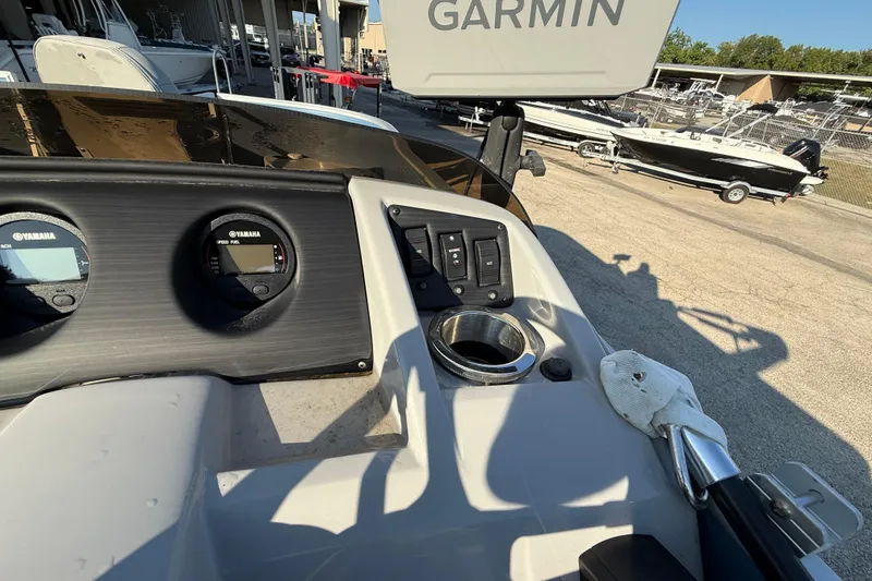 Slide: The Image of 2021 Bennington 20SFi boat dashboard with Yamaha gauges and Garmin equipment. - 23