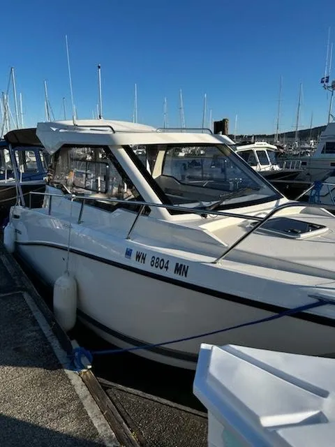 Slide: The Image of 2023 Bayliner Trophy T23 Explorer docked at marina under clear blue sky. - 3