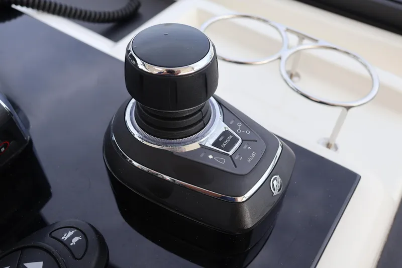 Slide: The Image of Joystick control on 2023 Aquila 36 Sport boat dashboard, featuring sleek design and functionality. - 22