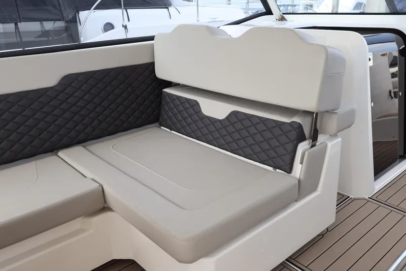 Slide: The Image of 2023 Aquila 36 Sport boat interior with quilted seating and modern design. - 25