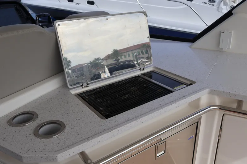 Slide: The Image of Outdoor kitchen on 2023 Aquila 36 Sport yacht with grill and cup holders. - 31