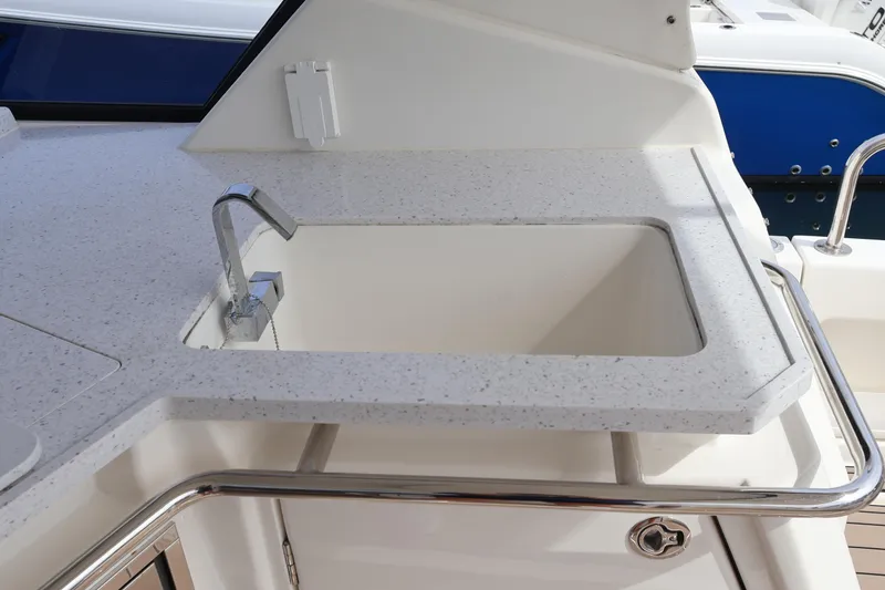 Slide: The Image of Aquila 36 Sport 2023 boat sink with modern faucet and sleek countertop design. - 35