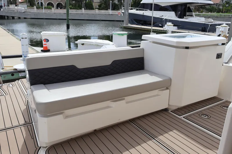 Slide: The Image of 2023 Aquila 36 Sport boat seating area with modern design at marina. - 36