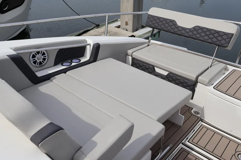 Slide: The Image of 2023 Aquila 36 Sport boat interior with cushioned seating and speaker system. - 47