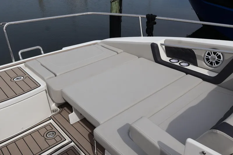 Slide: The Image of 2023 Aquila 36 Sport boat with spacious sunbathing deck and modern speaker system. - 48