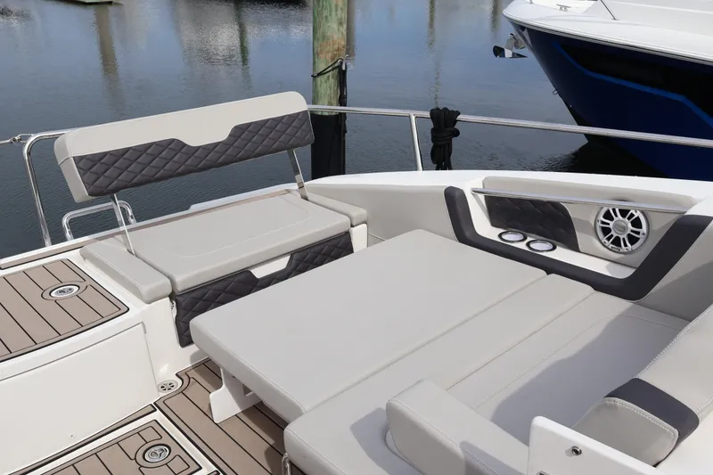 Slide: The Image of 2023 Aquila 36 Sport boat interior with cushioned seating and modern design. - 49