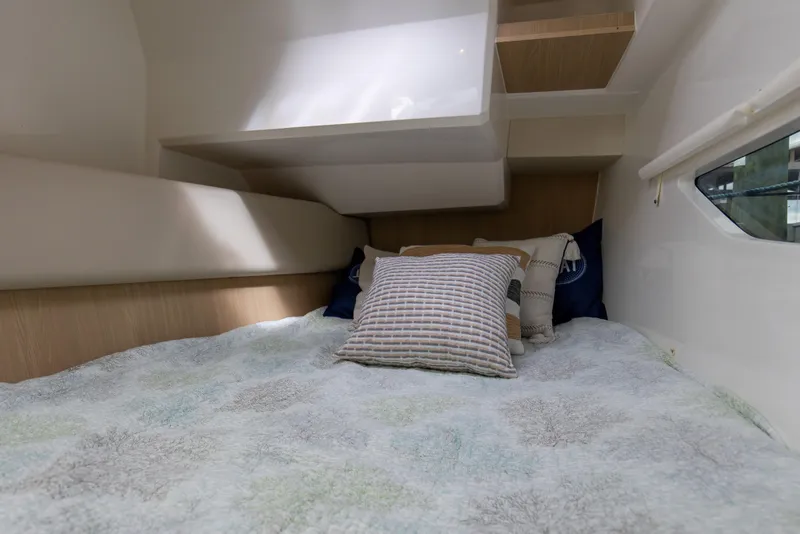 Slide: The Image of Cozy cabin interior of 2023 Aquila 36 Sport with comfortable bedding and pillows. - 55