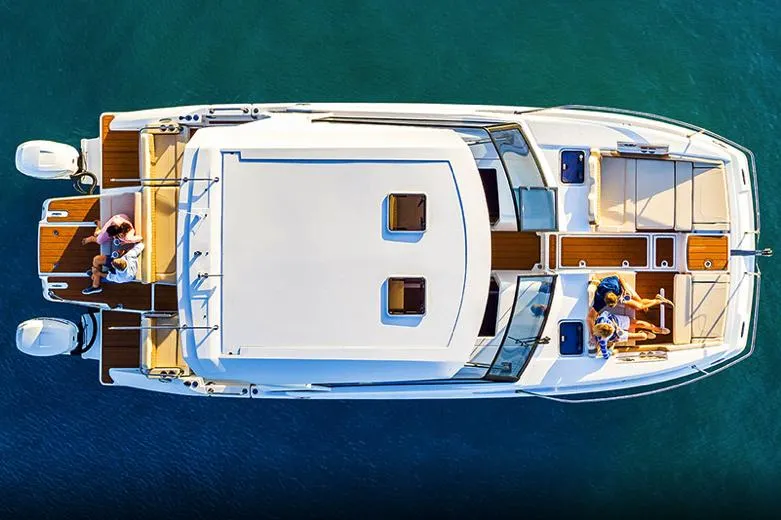 Slide: The Image of Manufacturer Provided Image: Aerial view of 2023 Aquila 36 Sport yacht on clear blue water. - 56