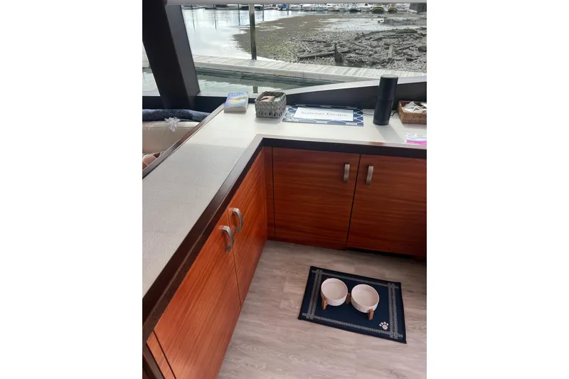 Slide: The Image of Luxurious interior of a 2011 Hatteras 60 Motor Yacht with modern furnishings. - 10